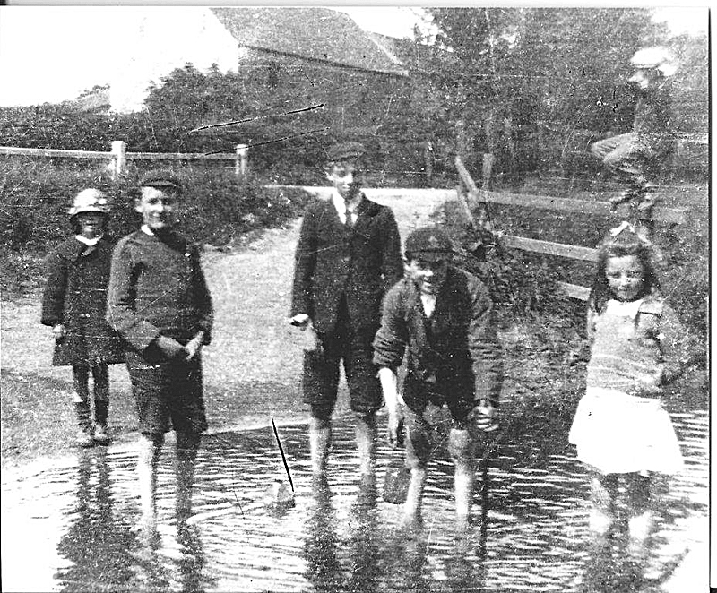 Children playing in the shallows of the Foss, 1917